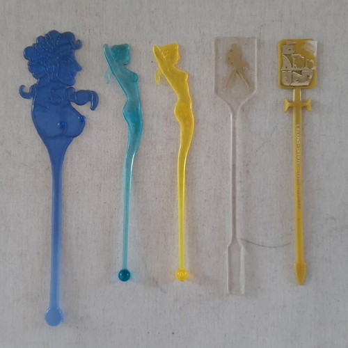 Set of 5 used plastic Caravel Hotel drink stirrers