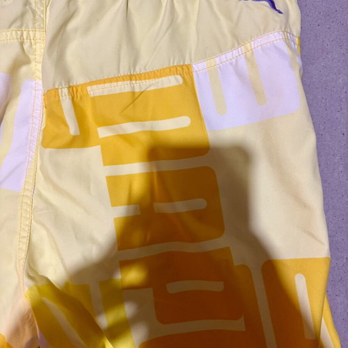 Puma men's yellow swim shorts, new