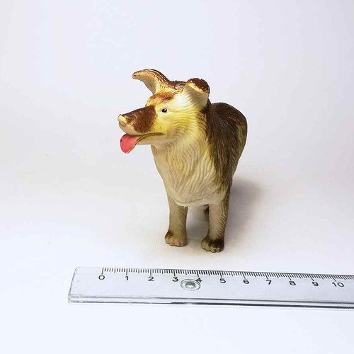 Dog plastic figure used with scratches and marks