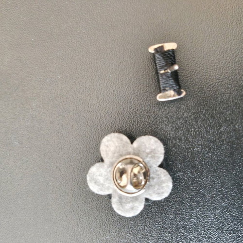 Set of two men's lapel pins like new, black and silver