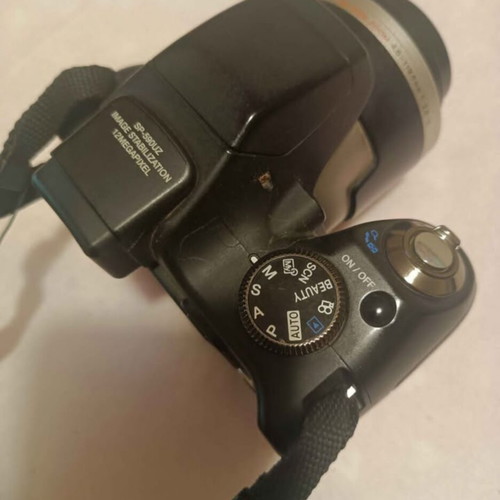 Olympus SP590UZ digital camera used, 26x zoom, retro style