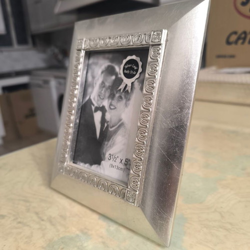 Silver photo frame like new with elegant decorative border