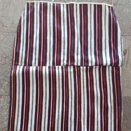 Traditional apron with vertical stripes used