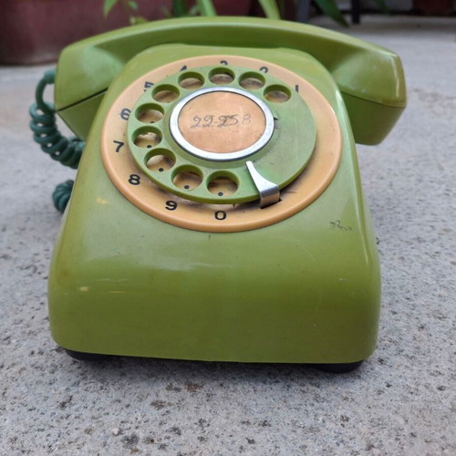 Vintage green rotary dial telephone used