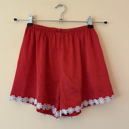 A-Style satin red shorts used with white flowers