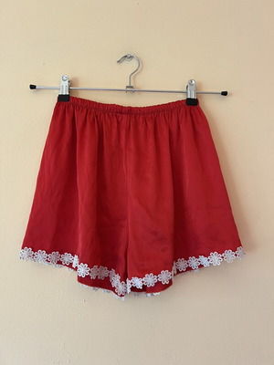 A-Style satin red shorts used with white flowers