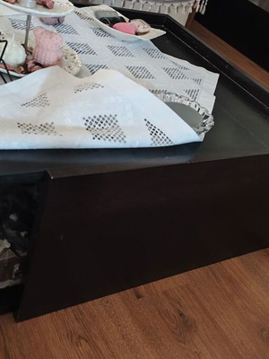 Coffee table with storage compartment