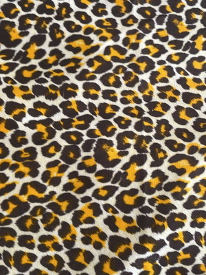Animal print fabric for upholstery and throws, white with brown and orange