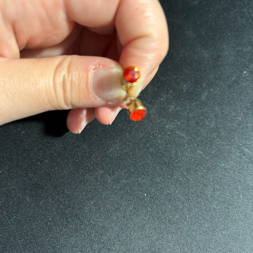 Earrings with red rhinestones used