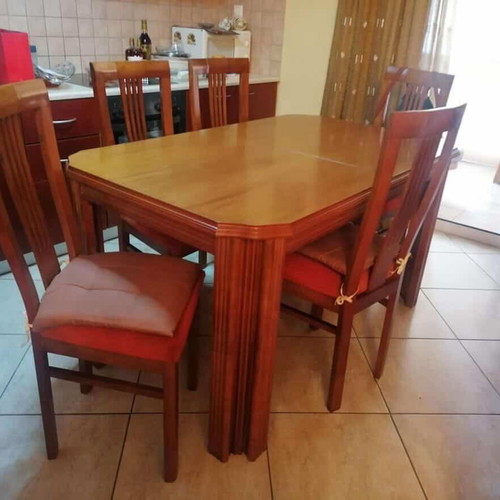 Wooden dining table with 6 chairs used, extends to 12 people