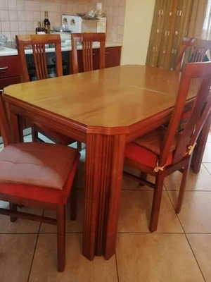 Wooden dining table with 6 chairs used, extends to 12 people