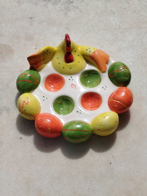 Chicken egg holder with colorful eggs in porcelain new for festive table