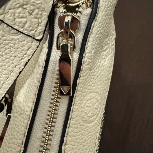 Guess white shoulder bag used with embossed logo pattern