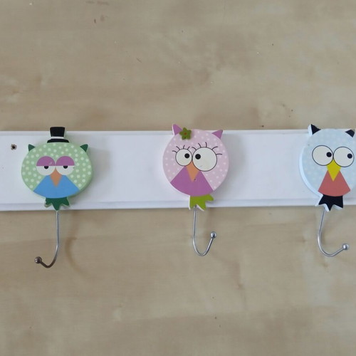 Wooden children's wall clothes hanger with three owl figures used