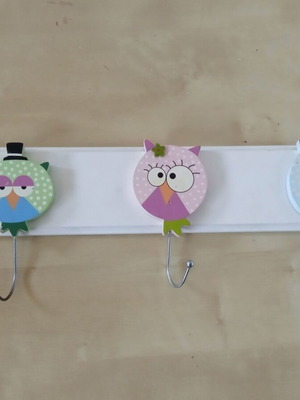Wooden children's wall clothes hanger with three owl figures used