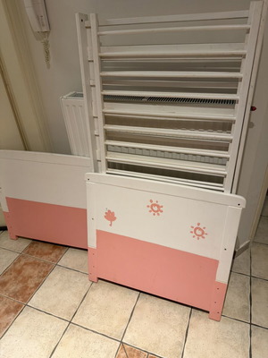 Wooden baby cot, white and pink with side rails
