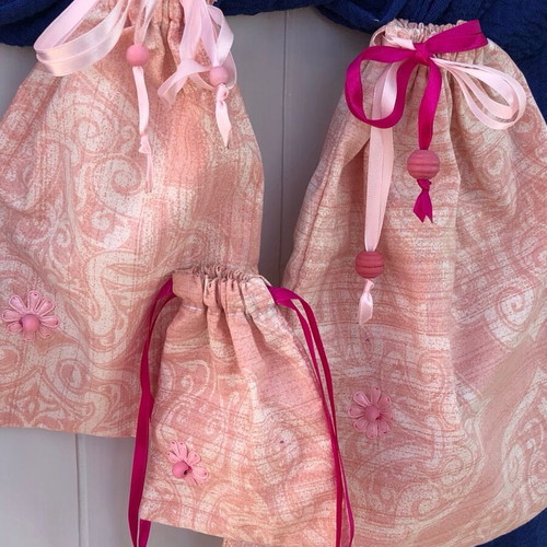 Set of three handmade pink pouches new, cotton with wooden beads