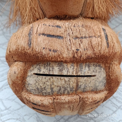 Handmade coconut shell money box with straw hat