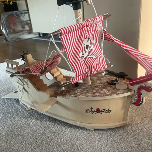 Wooden pirate ship used with small break and marker stains