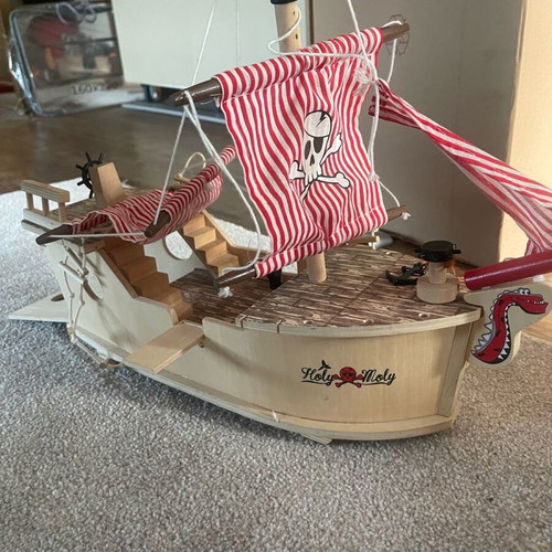 Wooden pirate ship used with small break and marker stains