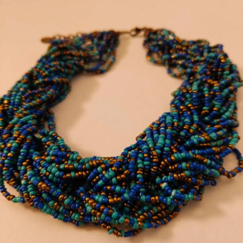 Statement necklace like new with blue and gold braided seed beads