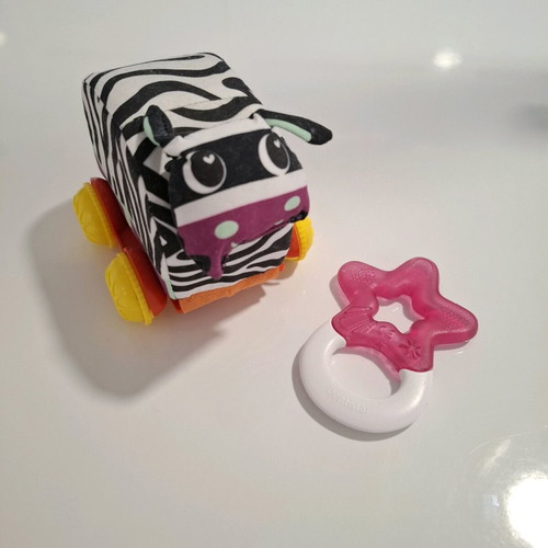 Luna fabric animal with wheels and teether star like new