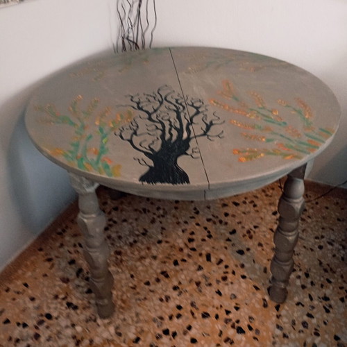 Round table with painted design, chalk paint