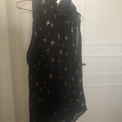Black sleeveless blouse with gold motifs like new