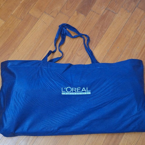 Travel sack used with handle and wheels, beige and blue