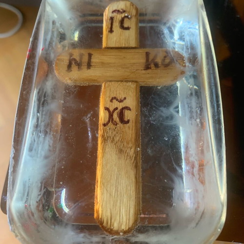 Silver cross with eye and wooden cross in liquid glass new