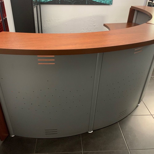 Reception desk used with metal perforated front panel