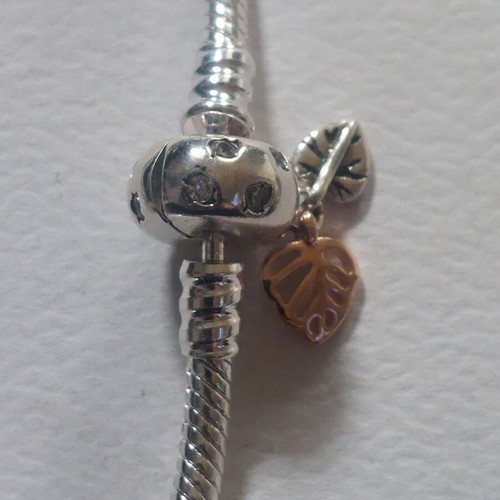 Pandora bracelet size 18 with round clasp and two leaf charms