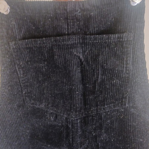 Black corduroy salopette with front and side pockets