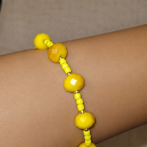Handmade yellow bracelet with stainless steel beads