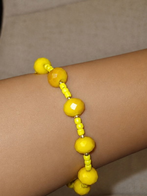 Handmade yellow bracelet with stainless steel beads