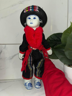 Vintage porcelain doll of Yao tribe like new
