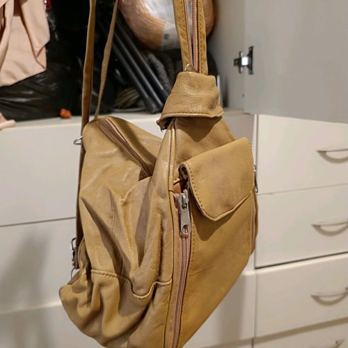 Leather backpack beige like new with multiple pockets and zippers