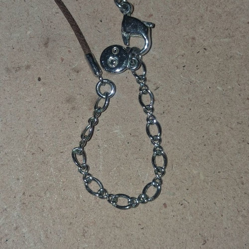Swarovski vintage flower pendant with brown cord like new