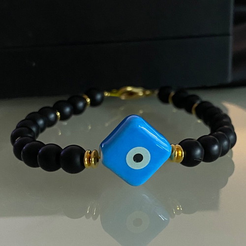 Handmade bracelet with haolite semi-precious stones and ceramic eye motif