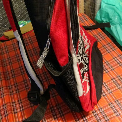 School bag used, red with multiple compartments