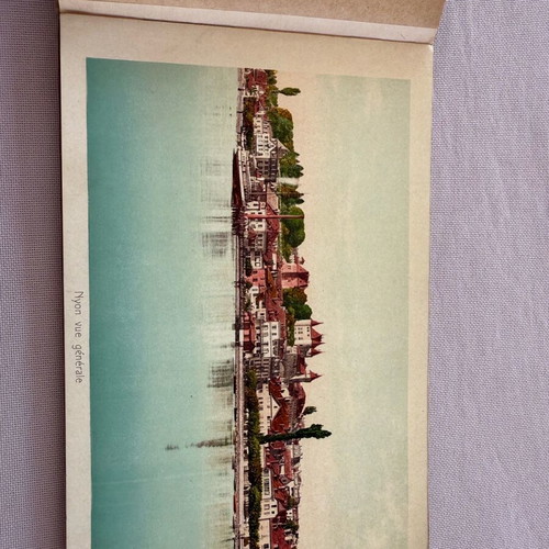 Leather-bound book with used Swiss Geneva postcard images