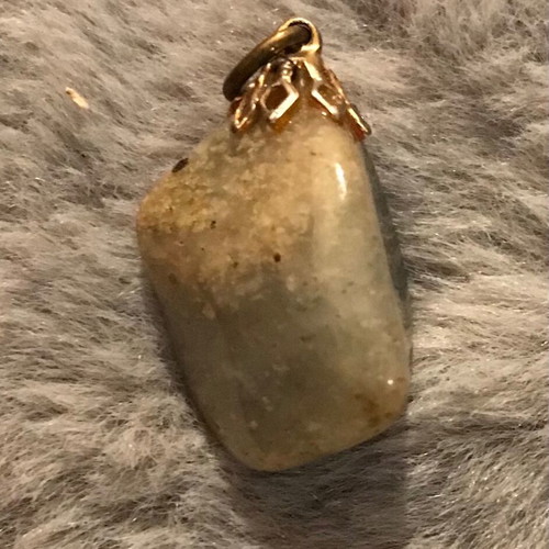 Quartz pendant with rutilated inclusions new, green and gold