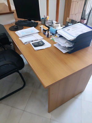 Desk with bookshelf and auxiliary table used