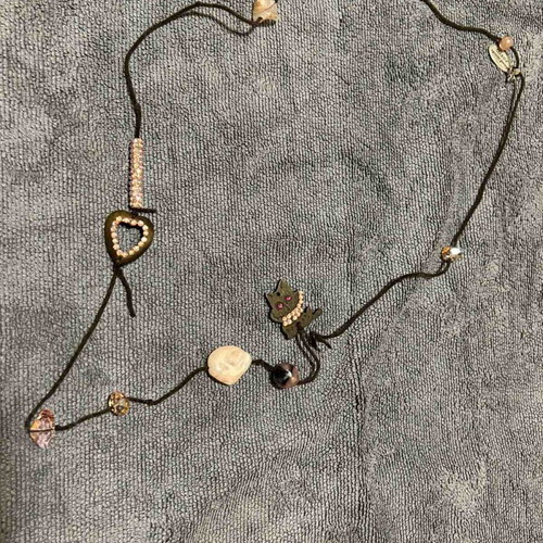 Necklace with brown leather cord and pink beads used