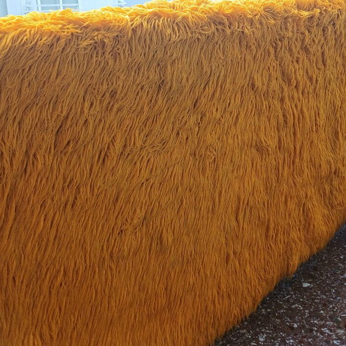 Handmade flokati rug used, orange to yellow (mustard)