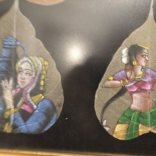 Painting with African figures hand-painted on dried leaves with gold frame and glass