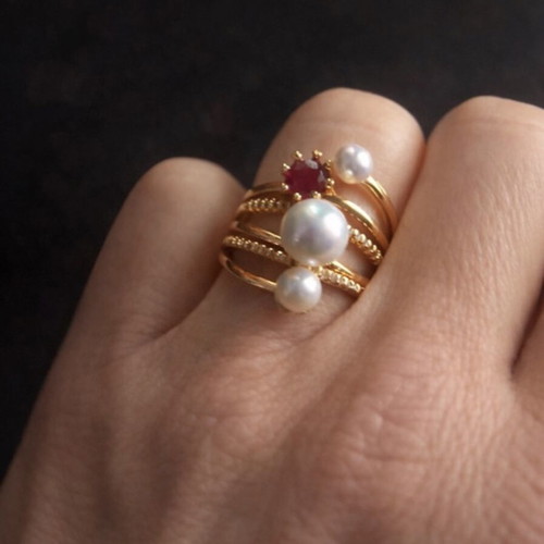 Gold ring with pearls and red stone