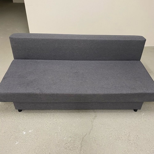 Three-seater sofa bed like new with storage space and 3 cushions