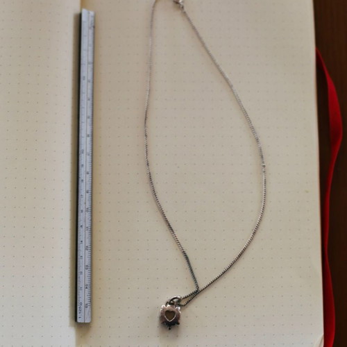 Silver necklace with heart used