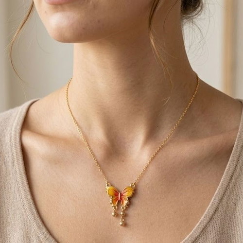 Gold necklace with butterfly, like new, orange accents